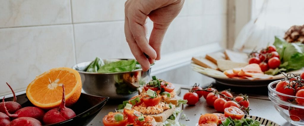 A chef preparing plates of food.