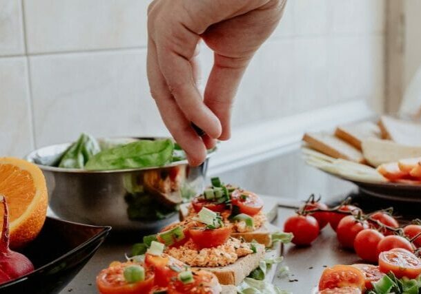 A chef preparing plates of food.